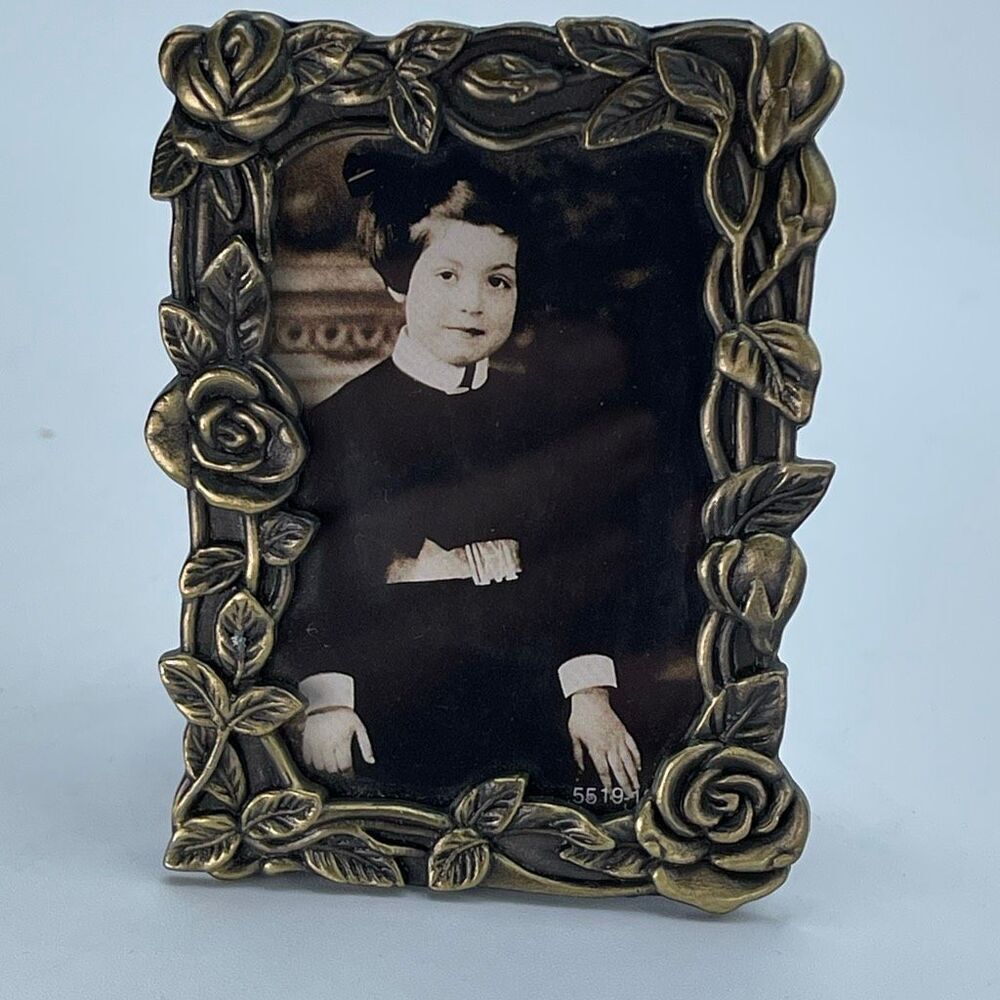 Vintage ornate Art Nouveau bronze miniature picture frame.